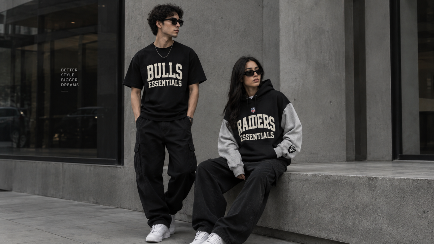 Two models wearing a black Bulls Essentials T-shirt and a black-and-grey Raiders Essentials hoodie with casual streetwear outfits.